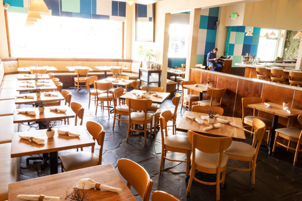  Interior shot with big window, lots of light and table arrangement